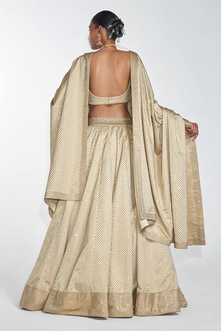 Shop Itrh Gold Lining Butter Crystal V Neck Embellished Lehenga Set at Aza Fashions Shop_Itrh_Gold Lining Butter Crystal V Neck Embellished Lehenga Set_at_Aza_Fashions