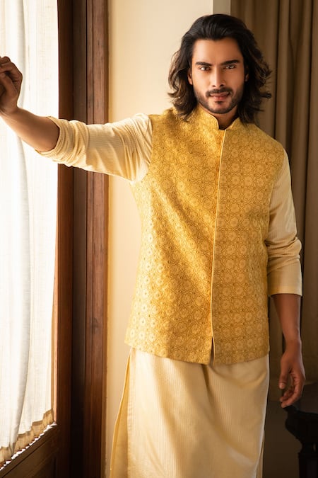 Shop Darshika Menswear Yellow Silk Blend Floral Motifs, Zari Work, Jaal Embroidered Bundi And Kurta Set at Aza Fashions Shop_Darshika Menswear_Yellow Silk Blend Floral Motifs, Zari Work, Jaal Embroidered Bundi And Kurta Set_at_Aza_Fashions