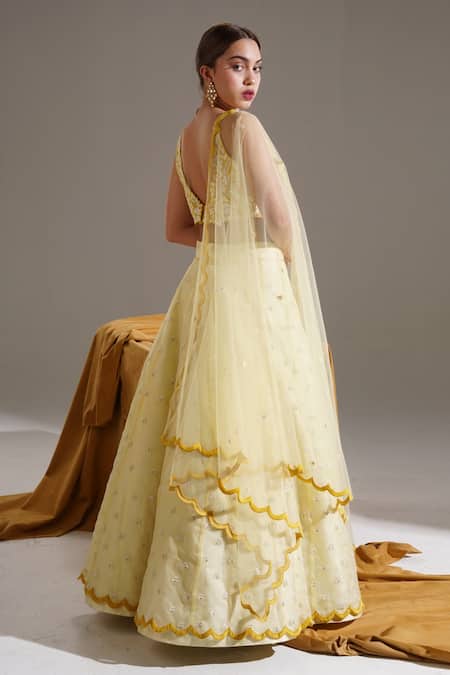 Shop Shloka Sudhakar Yellow Organza, Net, Suede Floral V Neck Embroidered Lehenga Set at Aza Fashions Shop_Shloka Sudhakar_Yellow Organza, Net, Suede Floral V Neck Embroidered Lehenga Set _at_Aza_Fashions