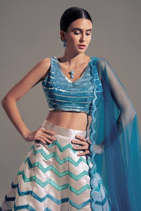 Shloka Sudhakar Pink Net, Satin, Suede Chevron V Neck Applique Work Lehenga Set Online at Aza Fashions Shloka Sudhakar_Pink Net, Satin, Suede Chevron V Neck Applique Work Lehenga Set _Online_at_Aza_Fashions