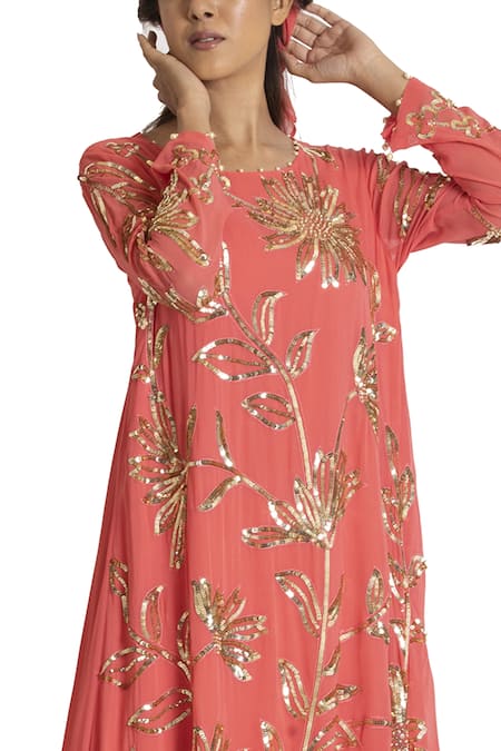 Shop Seams Pret And Couture Peach Georgette And Grand Satin Sequins Round Asymmetric Kurta & Dhoti Pant Set at Aza Fashions Shop_Seams Pret And Couture_Peach Georgette And Grand Satin Sequins Round Asymmetric Kurta & Dhoti Pant Set _at_Aza_Fashions