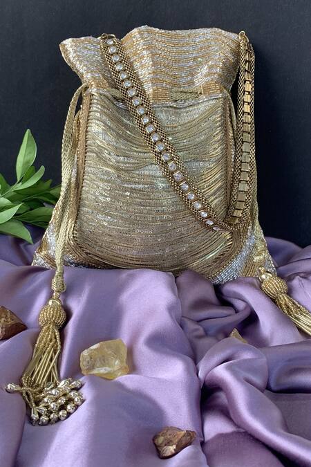 Nayaab By Sonia Gold Chains, Tassels, Beads, Hinted Silver Embellished Salli Work Potli Bag Online at Aza Fashions Nayaab By Sonia_Gold Chains, Tassels, Beads, Hinted Silver Embellished Salli Work Potli Bag _Online_at_Aza_Fashions