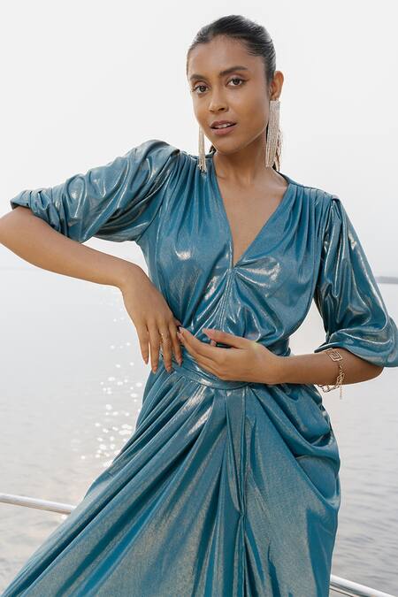 House Of Fett Blue Glitz Knit Fabric Plain V Neck Sardinia Draped Gown at Aza Fashions House Of Fett_Blue Glitz Knit Fabric Plain V Neck Sardinia Draped Gown _at_Aza_Fashions