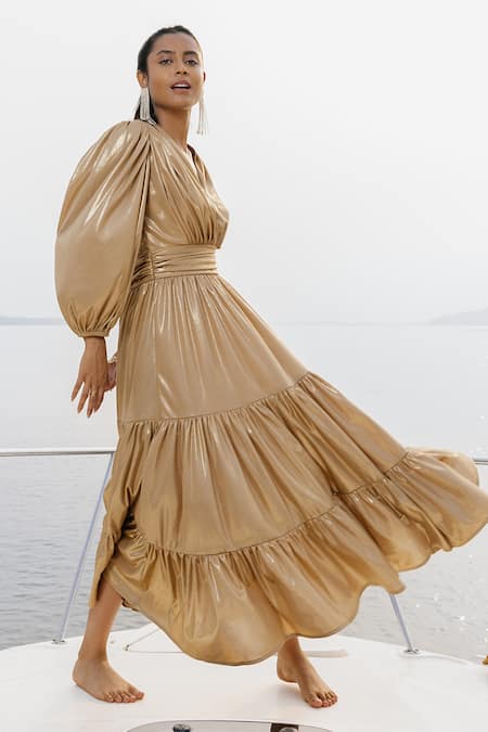 House Of Fett Gold 100% Knit Fabric Plain V Neck Tiered Gown Online at Aza Fashions House Of Fett_Gold 100% Knit Fabric Plain V Neck Tiered Gown_Online_at_Aza_Fashions