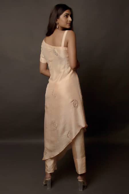 Shop Jasmine Bains Peach Cupro Crepe Asymmetric Tunic And Pant Set at Aza Fashions Shop_Jasmine Bains_Peach Cupro Crepe Asymmetric Tunic And Pant Set _at_Aza_Fashions