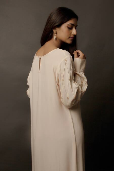 Shop Jasmine Bains Peach Cupro Georgette Round Embellished Tunic Online at Aza Fashions Shop_Jasmine Bains_Peach Cupro Georgette Round Embellished Tunic _Online_at_Aza_Fashions