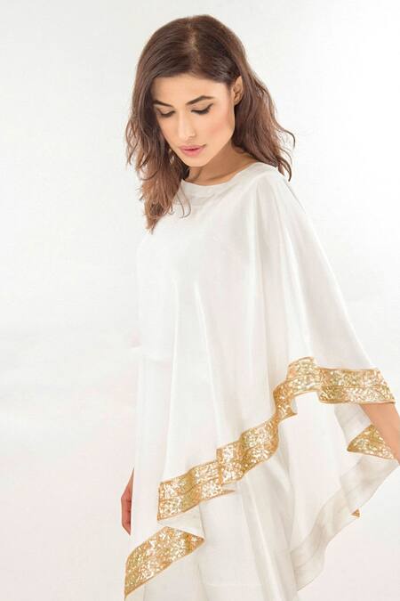 Buy Jasmine Bains Ivory Silk Sequin Round One Shoulder Cape And Trouser Set Online at Aza Fashions Buy_Jasmine Bains_Ivory Silk Sequin Round One Shoulder Cape And Trouser Set _Online_at_Aza_Fashions