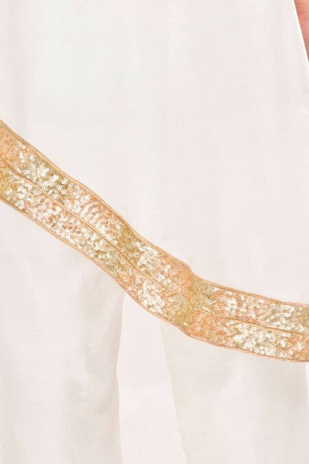 Shop Jasmine Bains Ivory Silk Sequin Round One Shoulder Cape And Trouser Set Online at Aza Fashions Shop_Jasmine Bains_Ivory Silk Sequin Round One Shoulder Cape And Trouser Set _Online_at_Aza_Fashions