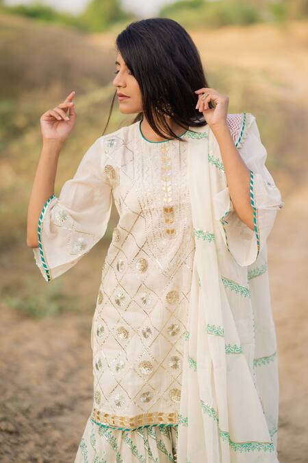 Buy_Kaia_White Cotton Mul Round Embroidered Kurta Sharara Set_Online_at_Aza_Fashions
