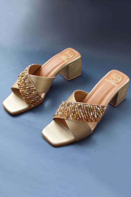Buy Gold Embellished Criss-cross Heels by Kaltheos Online at Aza Fashions.