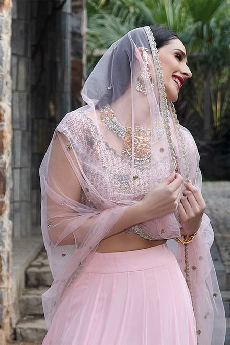 Shop Keerthi Kadire Peach Raw Silk, Crepe Scoop Neck Blouse And Lehenga Set at Aza Fashions Shop_Keerthi Kadire_Peach Raw Silk, Crepe Scoop Neck Blouse And Lehenga Set _at_Aza_Fashions