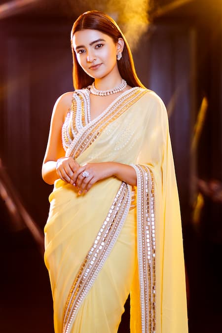 Saksham & Neharicka_Yellow Georgette Sequin And Pearl Embroidered Saree With Unstitched Blouse Piece_at_Aza_Fashions