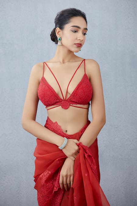 By Ushani Liyanage - Sexy, strappy red blouse saree blouse made in a crepe  silk with gold straps. Bra cut to give the bust line lift and shape. Suits  Kibbe category: Romantic.