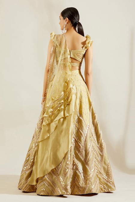 Shop Adaara Couture Gold Raw Silk, Net Sweetheart Neck Embellished Bridal Lehenga Set at Aza Fashions Shop_Adaara Couture_Gold Raw Silk, Net Sweetheart Neck Embellished Bridal Lehenga Set _at_Aza_Fashions