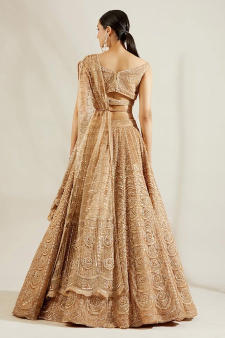 Shop Adaara Couture Gold Net, Satin V Neck Embellished Off Shoulder Lehenga Set at Aza Fashions Shop_Adaara Couture_Gold Net, Satin V Neck Embellished Off Shoulder Lehenga Set _at_Aza_Fashions