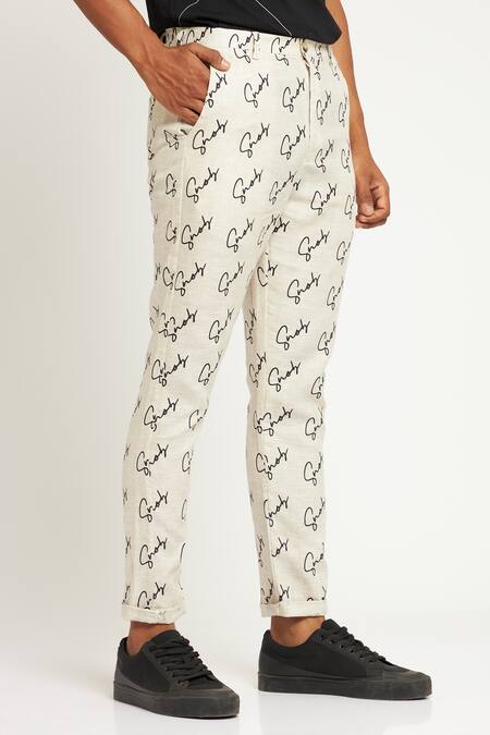 Son Of A Noble Snob Ivory 100% Linen Printed Logo Toco Signature Trouser Online at Aza Fashions Son Of A Noble Snob_Ivory 100% Linen Printed Logo Toco Signature Trouser_Online_at_Aza_Fashions