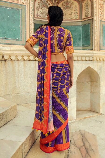 Orange colour Organza Banarasi saree with golden zari motif all over and  contrast pink zari border COST : 8900 INR ** Click on the link to pay and  buy... | By Vasthram