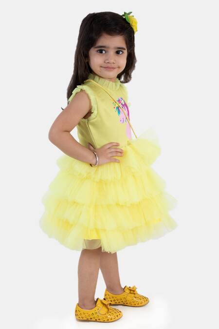 Shop Miakki Yellow Net, Satin Ruffles Unicorn Motif Dress at Aza Fashions Shop_Miakki_Yellow Net, Satin Ruffles Unicorn Motif Dress_at_Aza_Fashions