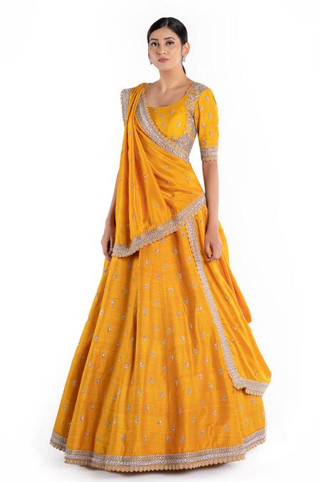 Mrunalini Rao_Yellow , Raw U Neck Embroidered Bridal Lehenga Set_Online_at_Aza_Fashions