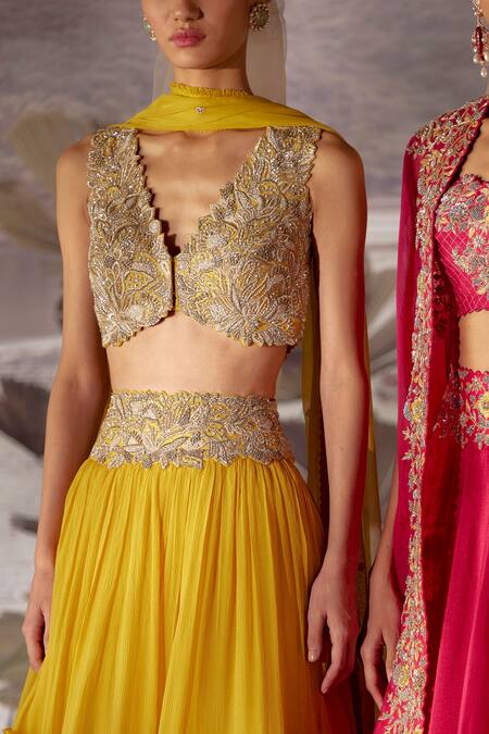 Mrunalini Rao_Yellow Raw Silk, Chiffon Floral V Neck Skirt Set With Embroidered Blouse _Online_at_Aza_Fashions