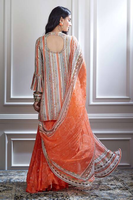 Shop Mandira Wirk - Indian Peach Chanderi V Neck Kurta And Sharara Set Online at Aza Fashions Shop_Mandira Wirk - Indian_Peach Chanderi V Neck Kurta And Sharara Set _Online_at_Aza_Fashions