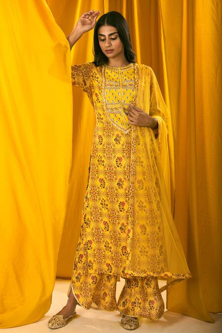 Shop_Label Ne'chi_Yellow Muslin Silk Printed Floral Round Kurta Set  _at_Aza_Fashions