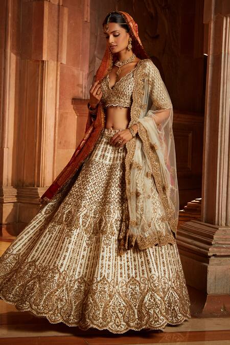 Nitika Gujral_Cream Tulle, Taffeta Zardozi Plunge V Intricate Embroidered Bridal Lehenga Set _Online_at_Aza_Fashions