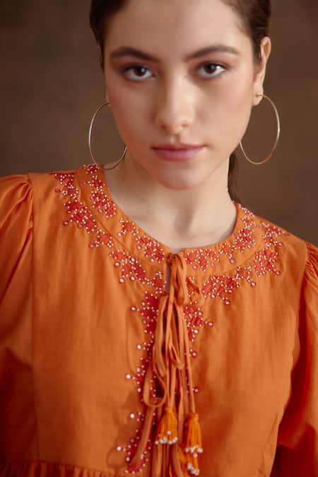 Buy_Nikasha_Orange Cotton, Silk Embroidery, Tassels Round Neck Placement Peplum Top _Online_at_Aza_Fashions