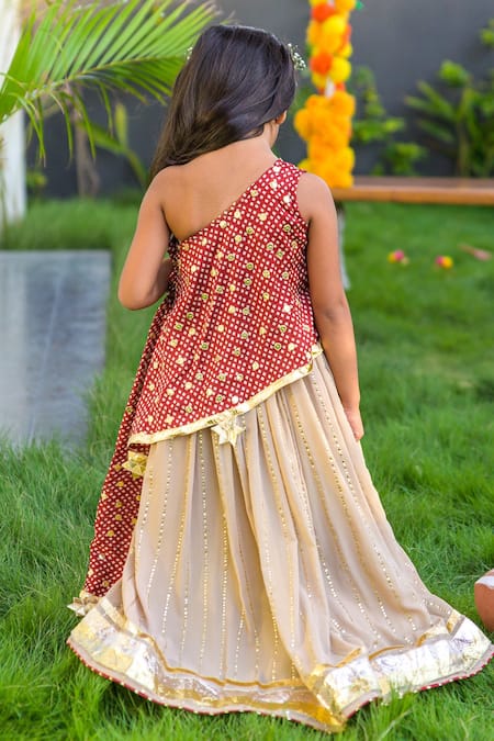 Shop Fairies Forever Gold Georgette Gota Patti, Embroidery One Shoulder Tunic And Lehenga Set at Aza Fashions Shop_Fairies Forever_Gold Georgette Gota Patti, Embroidery One Shoulder Tunic And Lehenga Set _at_Aza_Fashions