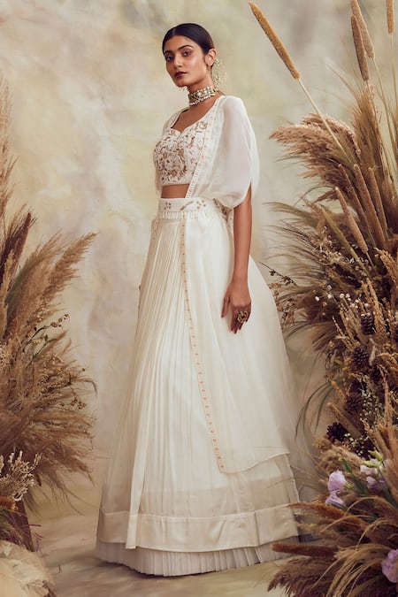 Niamh By Kriti White Georgette And Organza Pearl, Bead & Cutdana Embroidered Cape Lehenga Set Online at Aza Fashions Niamh By Kriti_White Georgette And Organza Pearl, Bead & Cutdana Embroidered Cape Lehenga Set _Online_at_Aza_Fashions