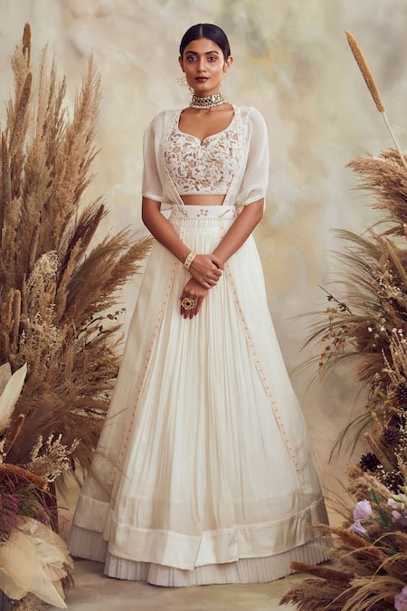 Buy Niamh By Kriti White Georgette And Organza Pearl, Bead & Cutdana Embroidered Cape Lehenga Set Online at Aza Fashions Buy_Niamh By Kriti_White Georgette And Organza Pearl, Bead & Cutdana Embroidered Cape Lehenga Set _Online_at_Aza_Fashions