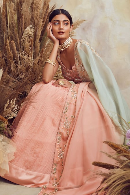 Prominent peach Colored Bridal wear Embroidered Lehenga Chol