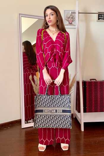 Shop_Nupur Kanoi_Pink Crepe V Neck Bandhani Print Knotted Jumpsuit_Online_at_Aza_Fashions
