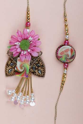 Shop Namasya Pink 3d Floral Motifs Bhaiya Bhabhi Rakhi Of 2 at Aza Fashions Shop_Namasya_Pink 3d Floral Motifs Bhaiya Bhabhi Rakhi Of 2_at_Aza_Fashions