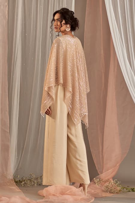 Shop_NIDHIKA SHEKHAR_Beige Crepe Cutdana Work, Pearl Work, Sequins, Sitaare Jumpsuit Cape Set _at_Aza_Fashions