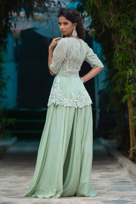 Shop Kanj By Priyanka A Sakhuja Green Silk Organza Sequin Work Illusion Olivia Peplum Top And Sharara Set at Aza Fashions Shop_Kanj By Priyanka A Sakhuja_Green Silk Organza Sequin Work Illusion Olivia Peplum Top And Sharara Set _at_Aza_Fashions