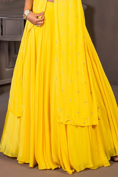 Shop Izzumi Mehta Yellow Net, Korean Crepe V Neck Embroidered Kurta And Lehenga Set at Aza Fashions Shop_Izzumi Mehta_Yellow Net, Korean Crepe V Neck Embroidered Kurta And Lehenga Set_at_Aza_Fashions