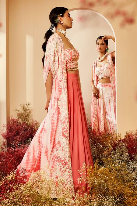 Priyaa Ivory Cape And Lehenga Georgette, Corset Silk Dori Work, Pearl Tie Dye & Set Online at Aza Fashions Priyaa_Ivory Cape And Lehenga Georgette, Corset Silk Dori Work, Pearl Tie Dye & Set _Online_at_Aza_Fashions
