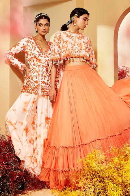 Shop Priyaa Orange Georgette Floral Embroidery Round Tiered Lehenga Set With Tie Dye Cape at Aza Fashions Shop_Priyaa_Orange Georgette Floral Embroidery Round Tiered Lehenga Set With Tie Dye Cape _at_Aza_Fashions