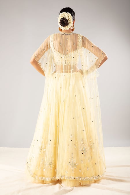 Shop Priyaa Yellow Net Sequin And Mirror Square Neck Embroidered Cape Lehenga Set at Aza Fashions Shop_Priyaa_Yellow Net Sequin And Mirror Square Neck Embroidered Cape Lehenga Set _at_Aza_Fashions