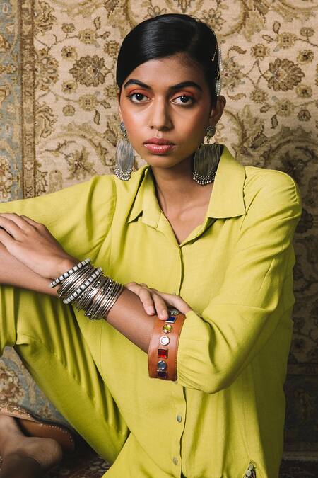 Shop Sonam Luthria Yellow Crepe Studs Leather Detailing, Tassels Embellished Pocket And Pant Set at Aza Fashions Shop_Sonam Luthria_Yellow Crepe Studs Leather Detailing, Tassels Embellished Pocket And Pant Set_at_Aza_Fashions