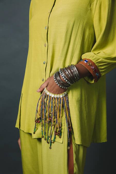 Shop Sonam Luthria Yellow Crepe Studs Leather Detailing, Tassels Embellished Pocket And Pant Set Online at Aza Fashions Shop_Sonam Luthria_Yellow Crepe Studs Leather Detailing, Tassels Embellished Pocket And Pant Set_Online_at_Aza_Fashions