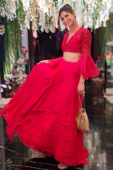 Baby Pink lehenga in net with a ready blouse in bell sleeves
