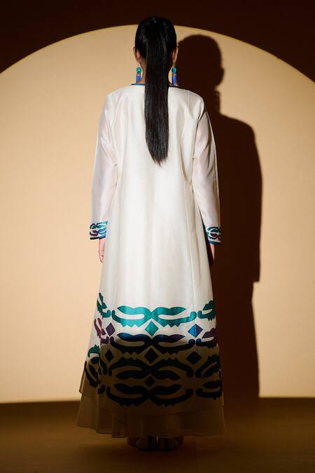 Shop Taika By Poonam Bhagat White Chanderi, Lycra Net Floral Motifs Round Applique Jacket Anarkali Set at Aza Fashions Shop_Taika By Poonam Bhagat_White Chanderi, Lycra Net Floral Motifs Round Applique Jacket Anarkali Set _at_Aza_Fashions