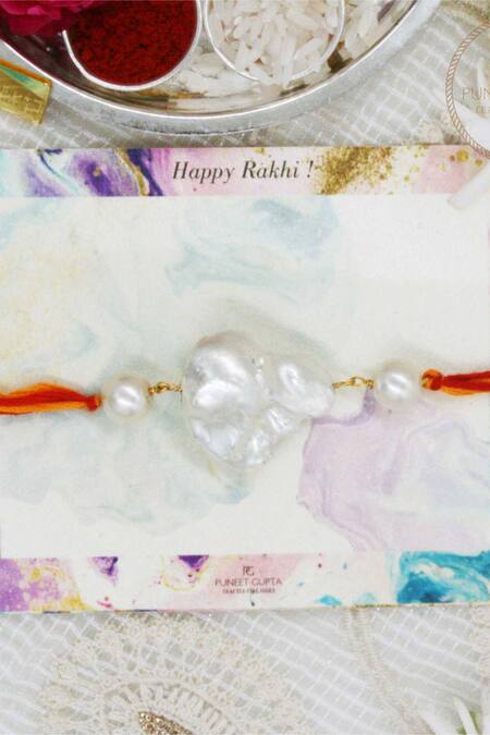 Puneet Gupta_Gold Pearls, Gemstones Embellished Rakhi_Online_at_Aza_Fashions