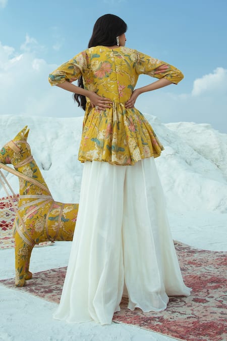 Shop Paulmi And Harsh Yellow Cotton Silk Round Printed Top With Flared Pant at Aza Fashions Shop_Paulmi And Harsh_Yellow Cotton Silk Round Printed Top With Flared Pant_at_Aza_Fashions