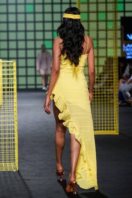 Shop Nirmooha Yellow Textured Georgette Plain Sweetheart Neck Asymmetric Front Cut Out Dress at Aza Fashions Shop_Nirmooha_Yellow Textured Georgette Plain Sweetheart Neck Asymmetric Front Cut Out Dress _at_Aza_Fashions
