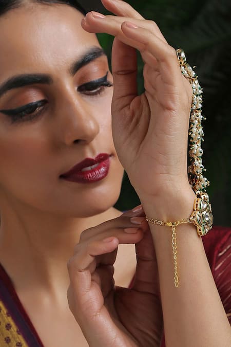 Buy Paisley Pop Gold Plated Pearls Kundan Hathphool Online at Aza Fashions Buy_Paisley Pop_Gold Plated Pearls Kundan Hathphool _Online_at_Aza_Fashions