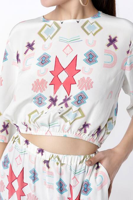 PS Pret By Payal Singhal White Crepe Ikat Star Round Crop Top And Jogger Pant Set Online at Aza Fashions PS Pret By Payal Singhal_White Crepe Ikat Star Round Crop Top And Jogger Pant Set_Online_at_Aza_Fashions