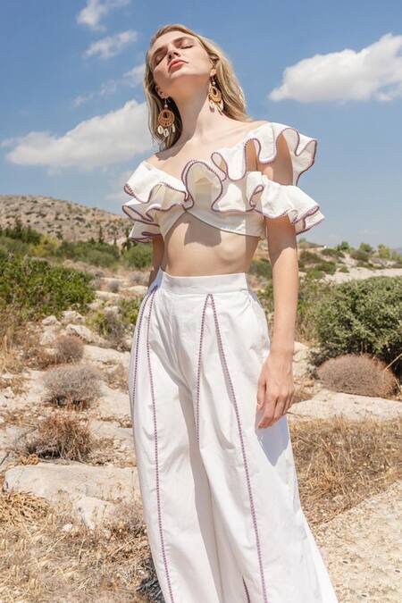 Shop Shruti Sancheti White Poplin, 100% Cotton Asymmetric Neck Ruffle Top And Pant Set Online at Aza Fashions Shop_Shruti Sancheti_White Poplin, 100% Cotton Asymmetric Neck Ruffle Top And Pant Set _Online_at_Aza_Fashions